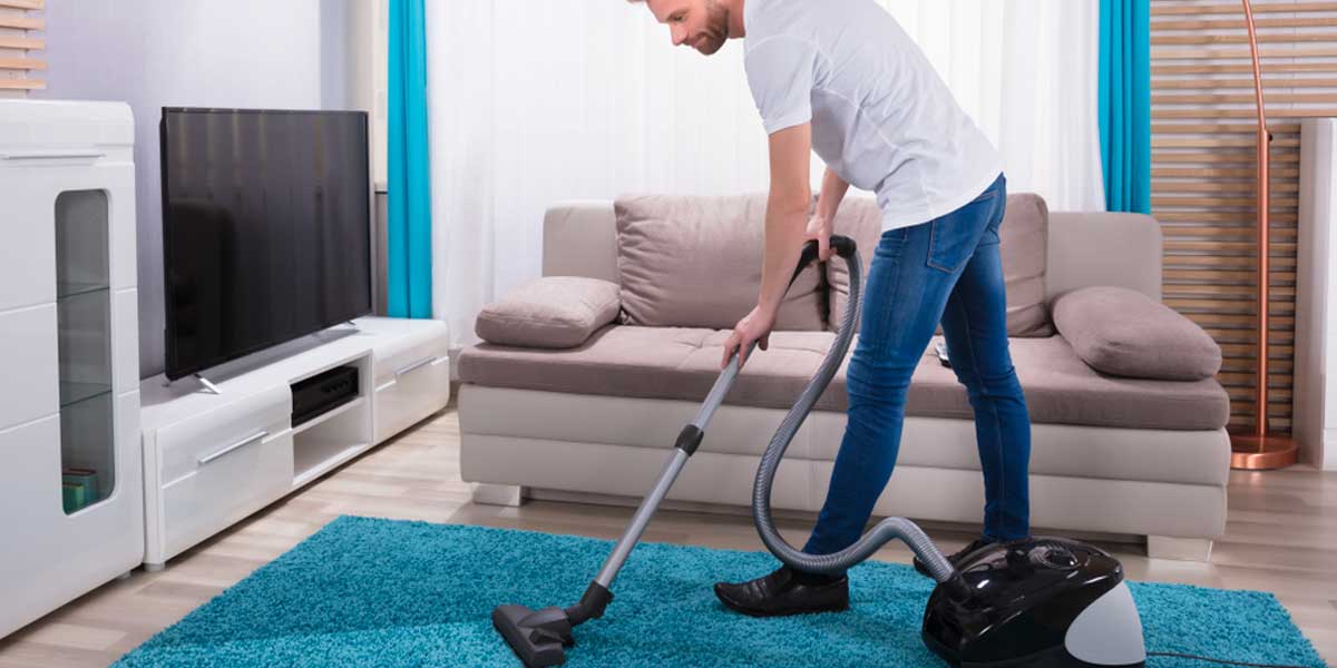 guy brushing his carpet